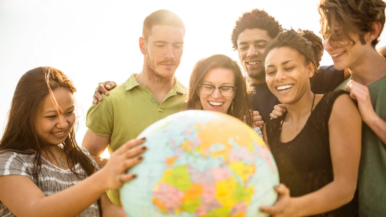 teenagers college student smiling with globe