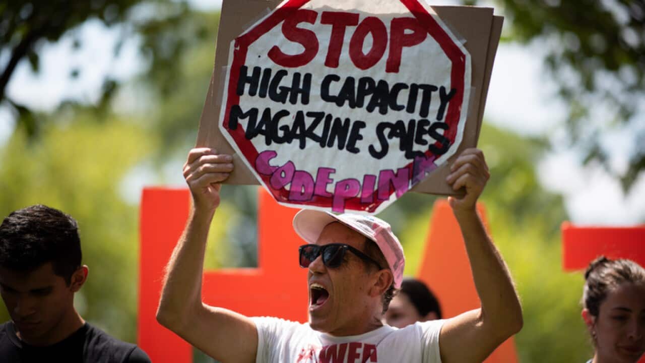 Tighe Barry, a Code Pink protester, takes part in the "Rally against White Supremacy" near the White House on August 6, 2019.