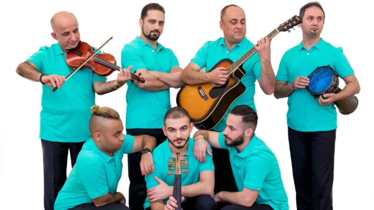 The Mesopotamian Ensemble posing for a photoshoot