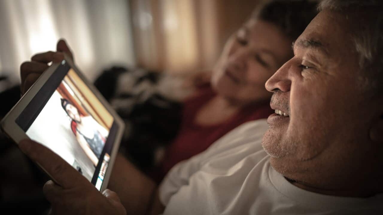 Grandparents / parents on a video chat with his son / grandson