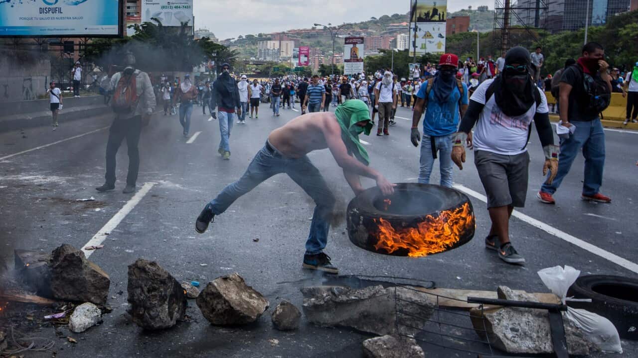 Demonstrators clash with the Venezuelan National Guard (GNB) in Caracas, Venezuela on April 10.
