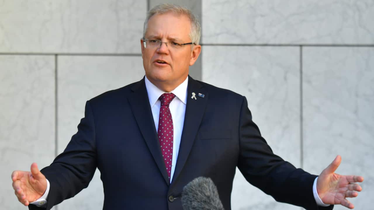 Prime Minister Scott Morrison talks to reporters on Thursday.