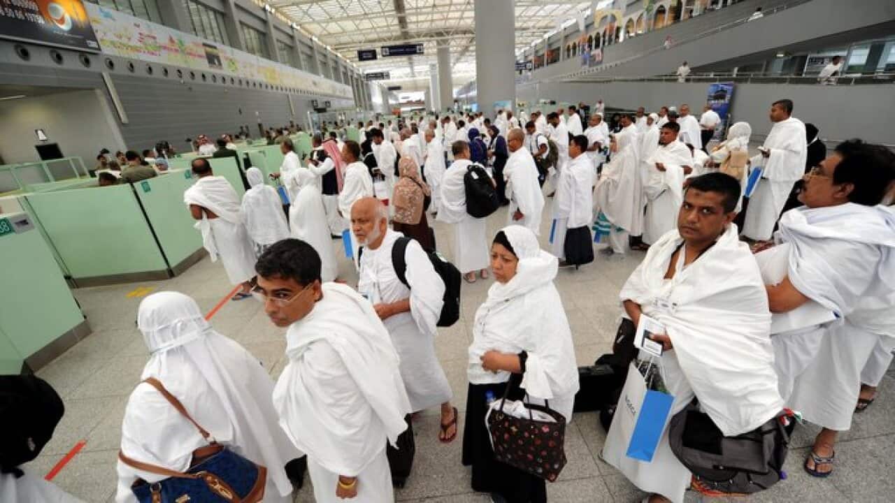 Muslim pilgrims go through passport control upon their arrival at Jeddah airport on July 14,2018. (Photo: AMER HILABI/AFP/Getty Images)