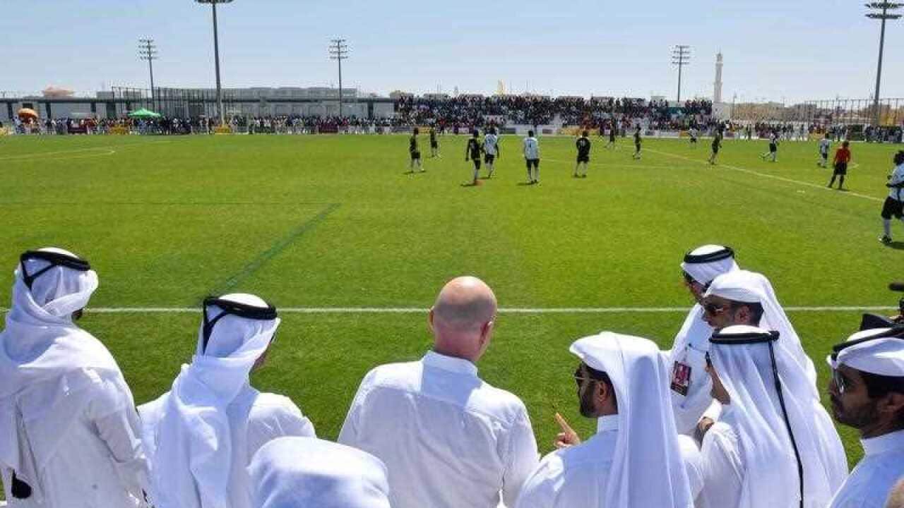 FIFA President Gianni Infantino (C) watches the 'Workers Cup Qatar 2016'