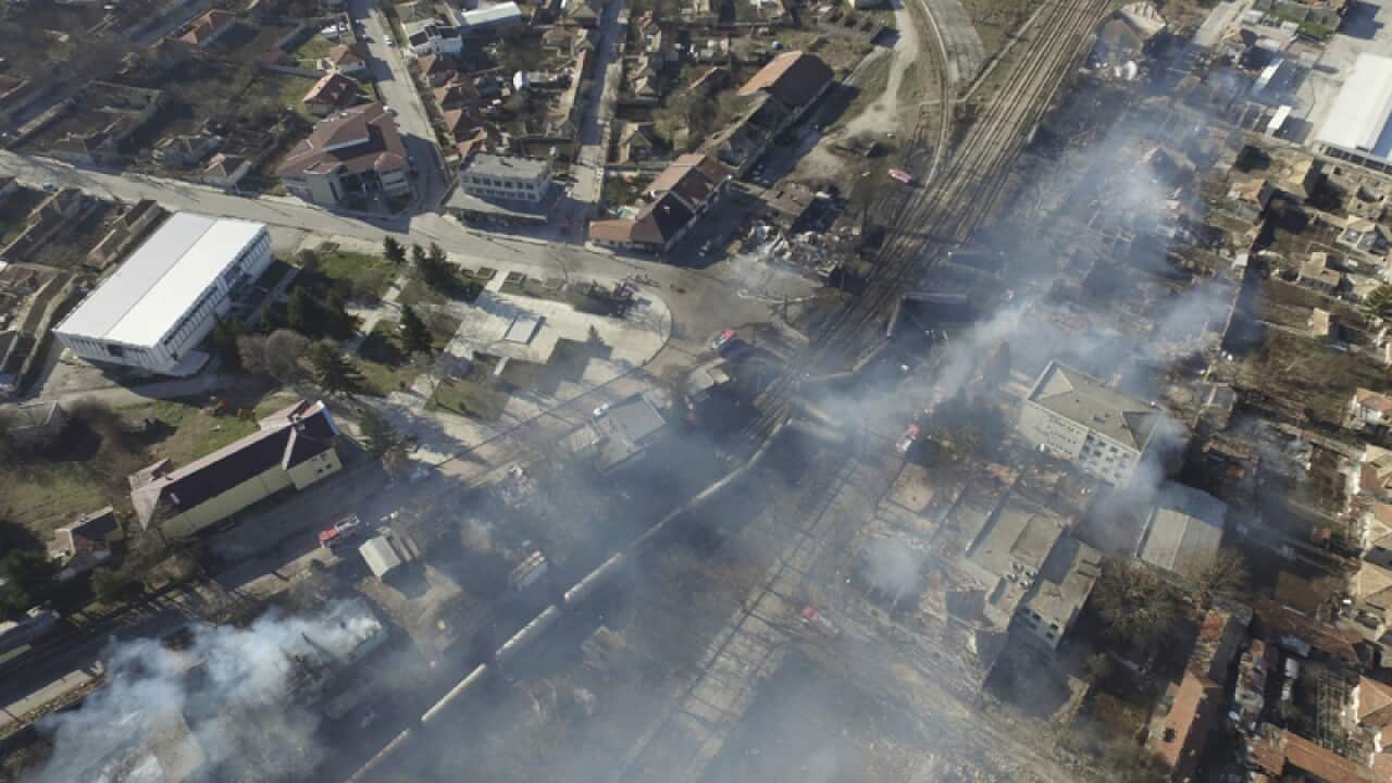 Smoke rises from the scene of after a tanker train derailed Bulgaria