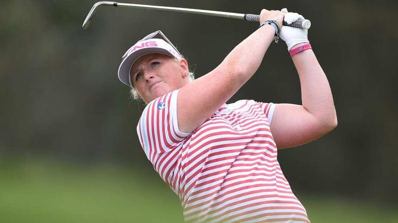 Holly Clyburn drives the ball.