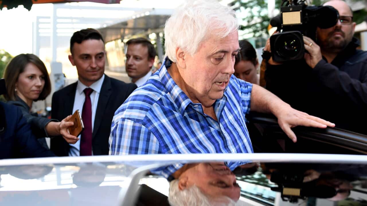 Clive Palmer leaves the Federal Court in Brisbane