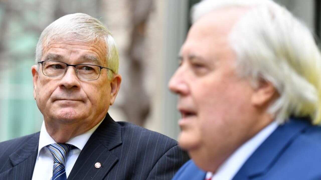 NSW Senator Brian Burston (L) and Clive Palmer.