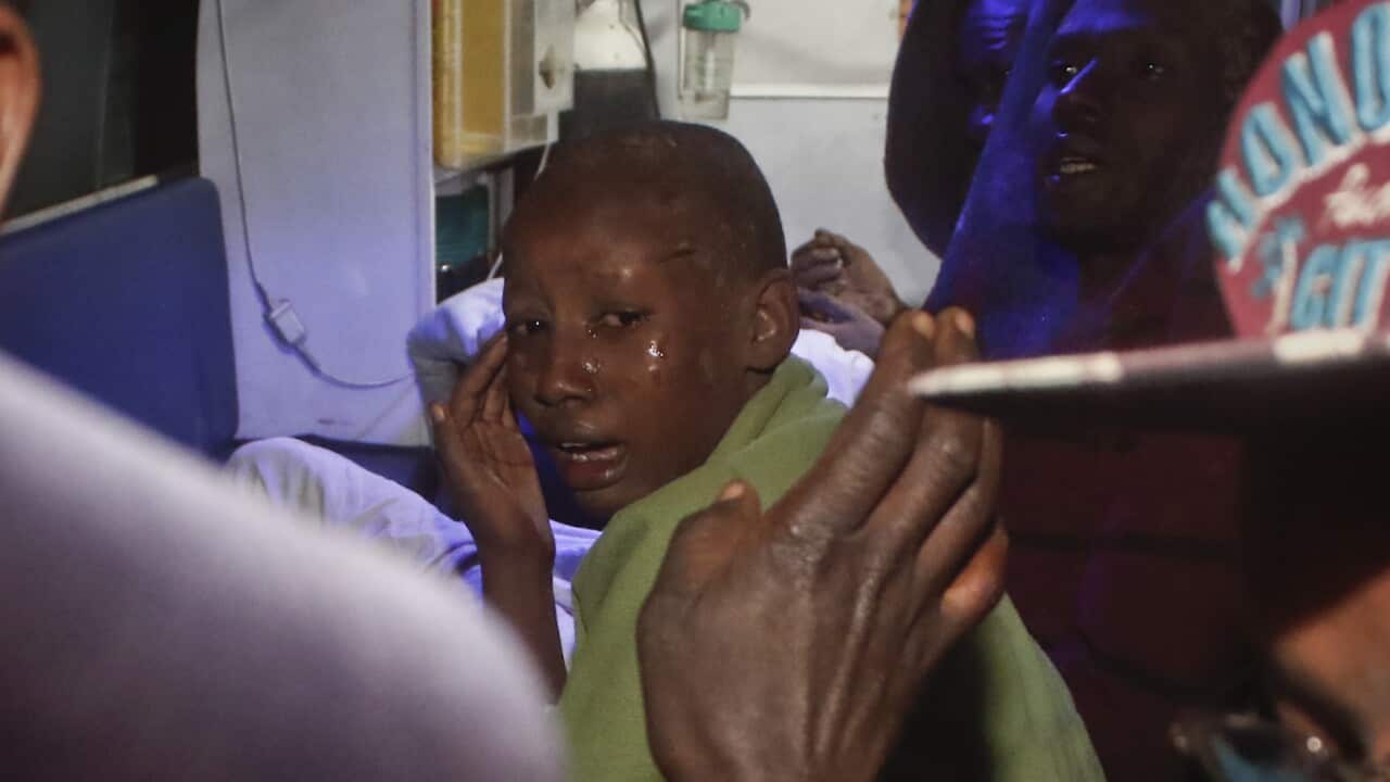 A child affected by the floods is taken away by ambulance during the early hours of Thursday, May 10, 2018 near Solai, in Kenya