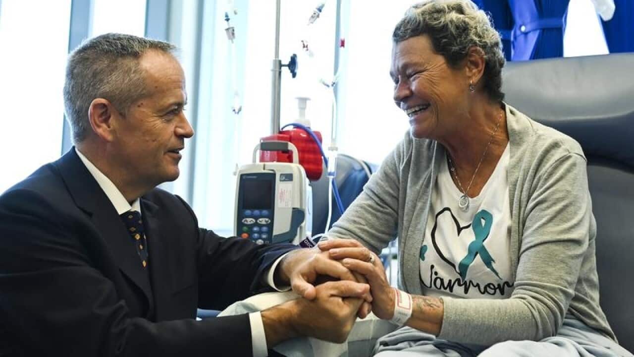 Bill Shorten speaks to cancer patient Debbie Tremble in Brisbane.