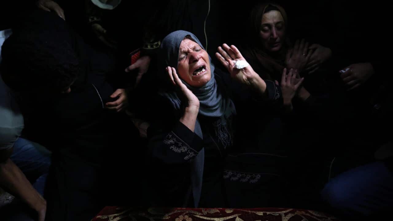 Relatives of Ahmed al-Shehri, 27, mourn over his body at the family house during his funeral in the town of Khan Younis, southern Gaza Strip.