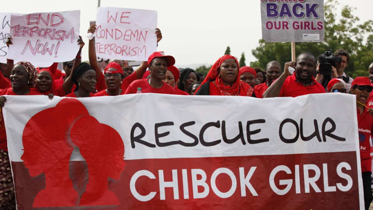 Scores of protesters chanting "Bring Back Our Girls" rally