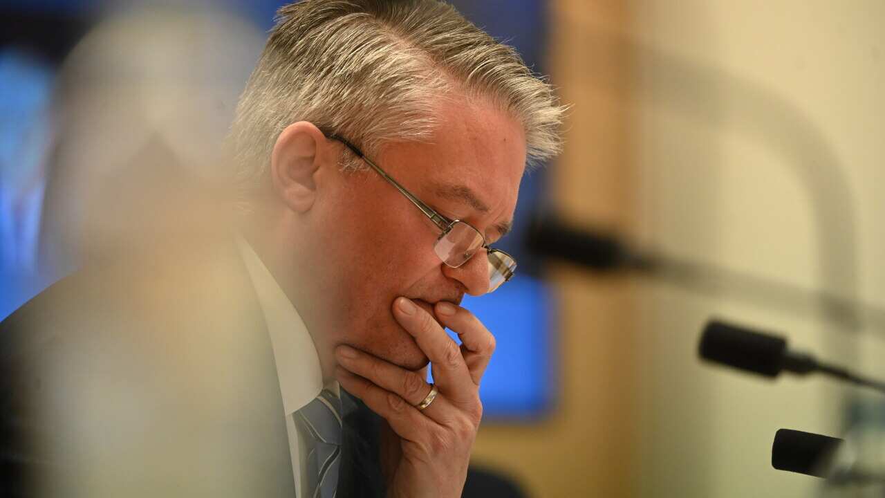 Australian Finance Minister Mathias Cormann reacts during a Senate inquiry at Parliament House in Canberra, Tuesday, June 9, 2020.