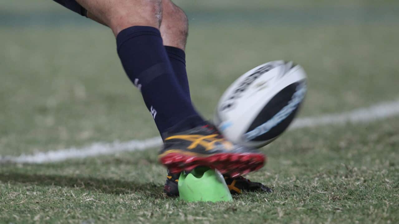 Johnathan Thurston kicks