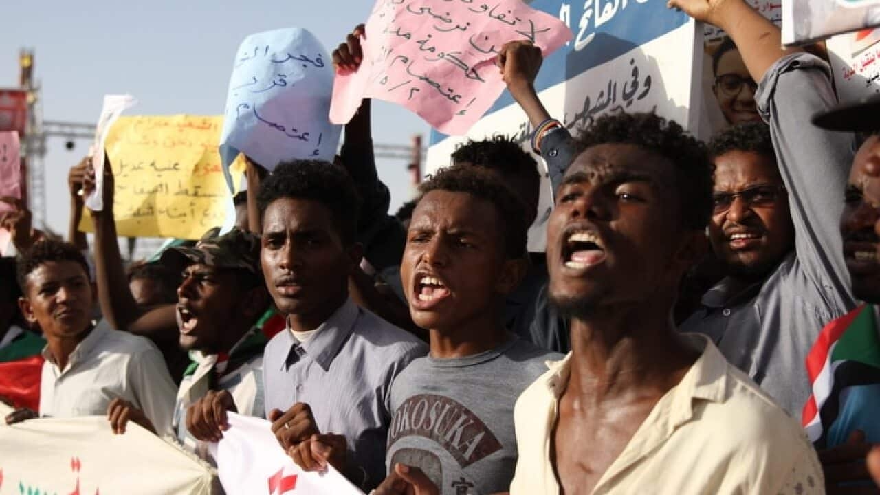 Sudanese protesters chant slogans during a protest outside the army headquarters in Khartoum, Sudan.