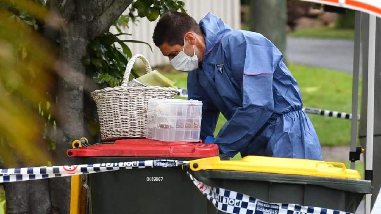 Police outside a house in the Brisbane suburb of The Gap.