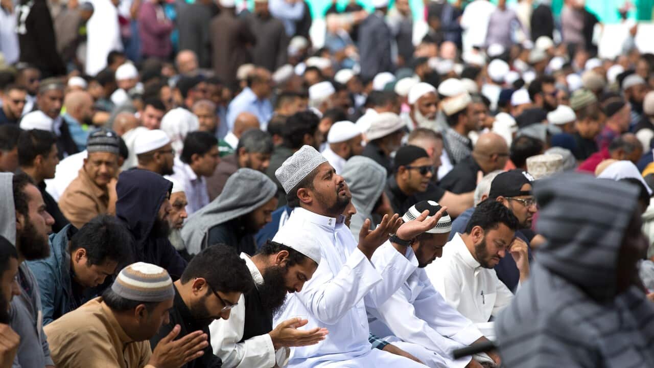 Muslims answer the call to pray at Hagley Park, opposite the Al Noor Mosque, one of the mosques hit by a gunman, Christchurch, New Zealand.