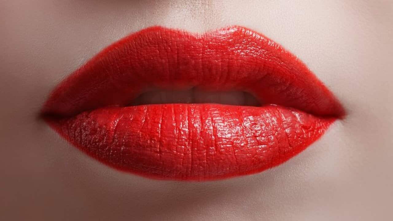 Close up of bright red shiny lips