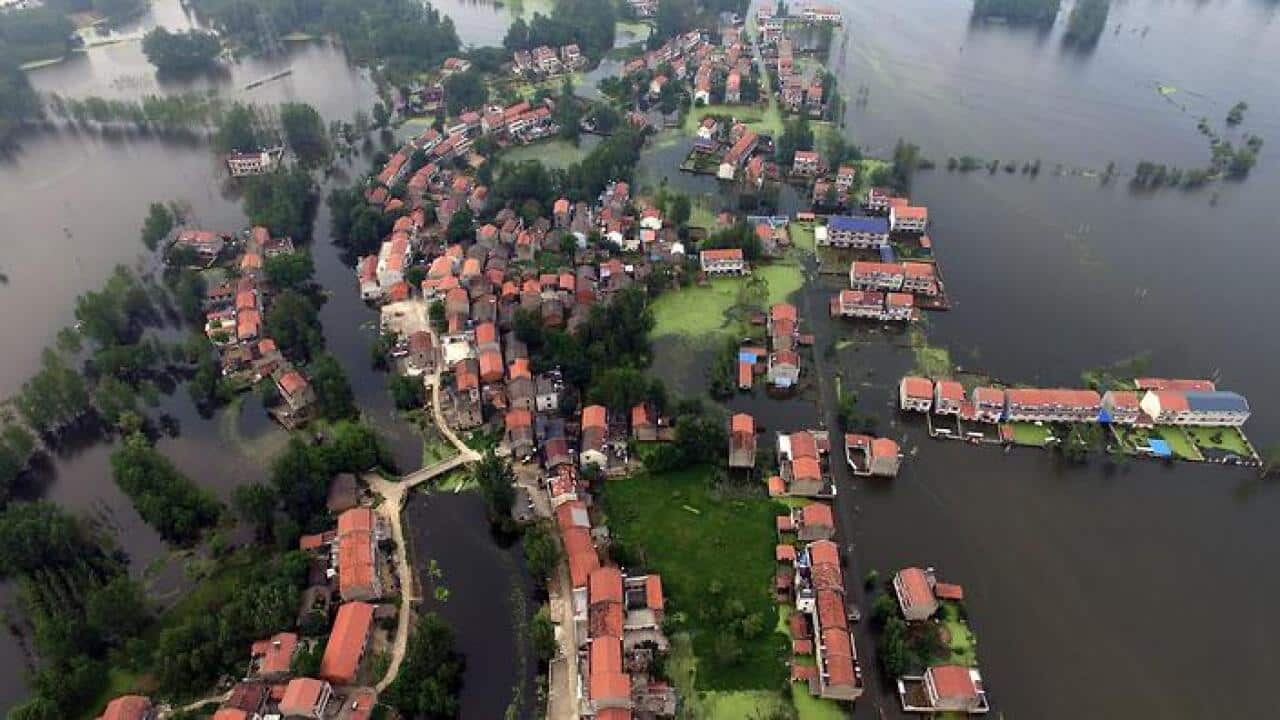 An aerial view of waters flooding Xinhua Village of Xinchang county in Wuhan city, Hubei Province (AAP)
