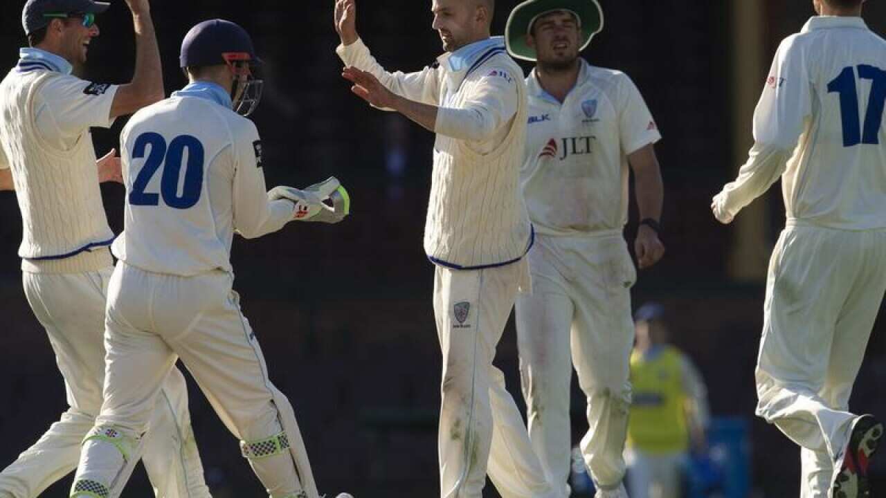 NSW and Test spin bowler Nathan Lyon (C)