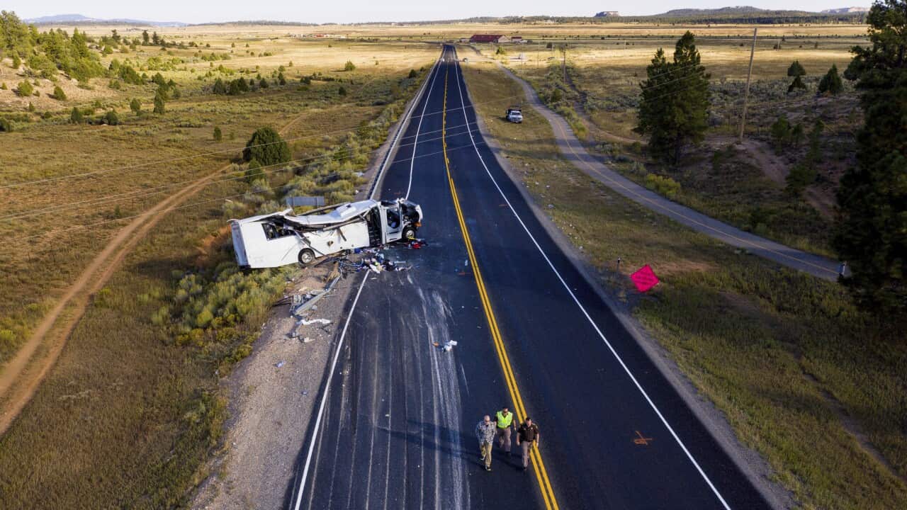 The remains of a bus that crashed while carrying Chinese-speaking tourists lie along State Route 12 near Bryce Canyon National Park, Friday, Sept. 20, 2019, in Utah, as authorities continue to investigate. (Spenser Heaps/The Deseret News via AP)