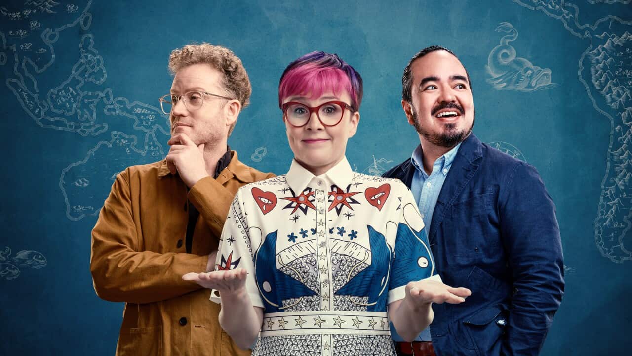 Trio of people, on with curly hair and hand on chin, one with pink hair and red glasses, one smiling while looking to the side.