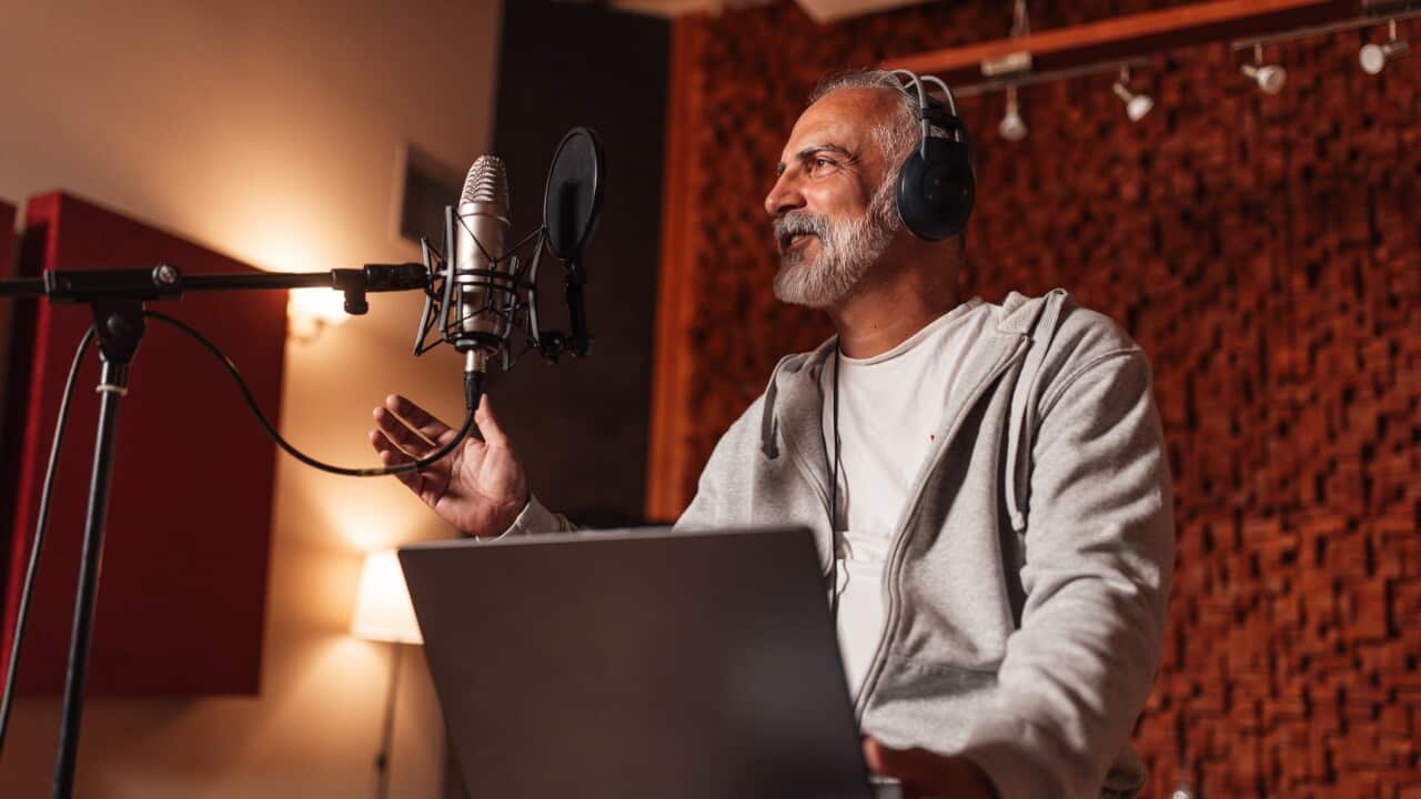 Man Recording Podcast in a Professional Studio Space