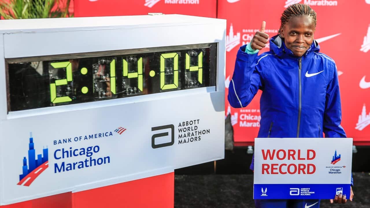 Brigid Kosgei of Kenya poses after setting a new women world record time of 02:14:04 in the 2019 Chicago Marathon in Chicago, Illinois, USA