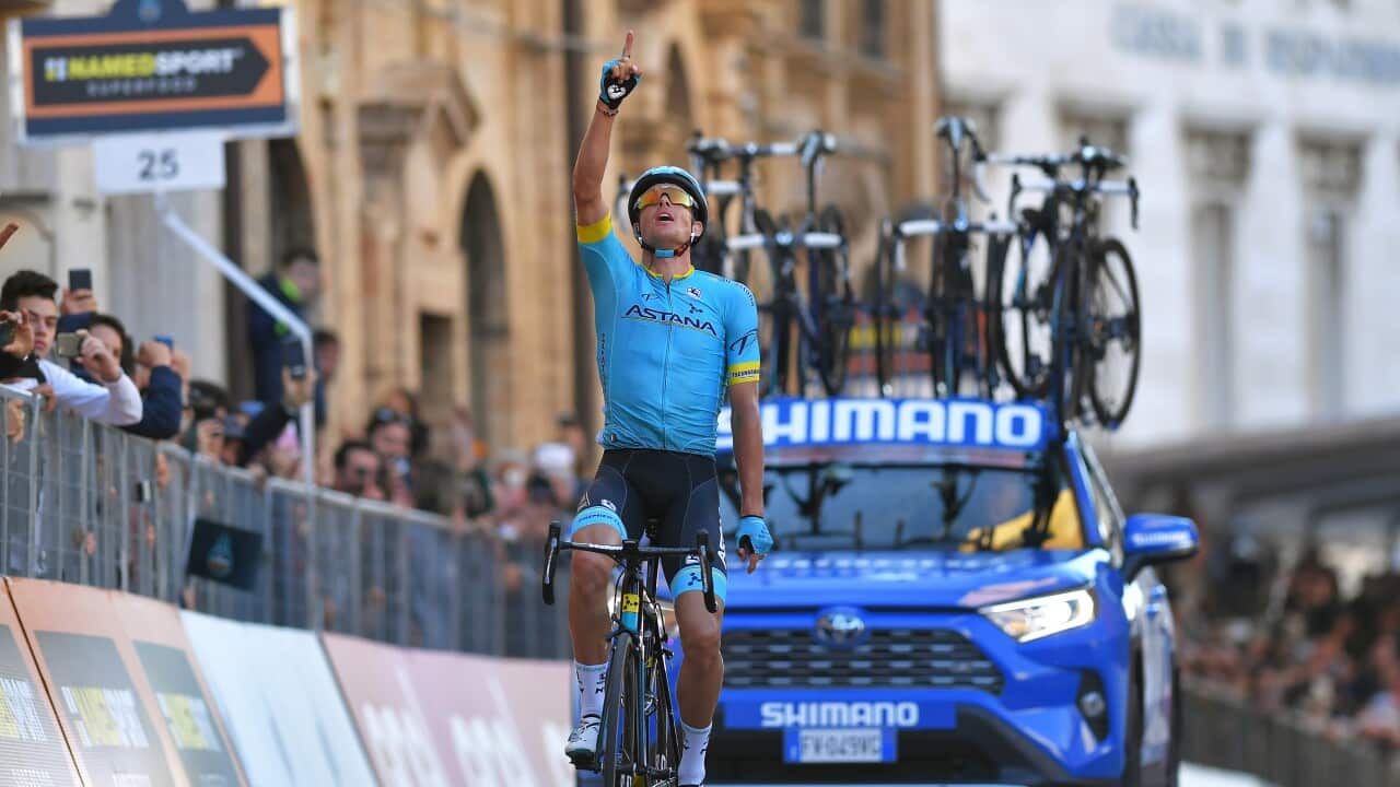 Jakob Fuglsang points to the sky in tribute to former Astana team mate Michele Scarponi who died in 2017 and came from nearby Filottrano (Getty)