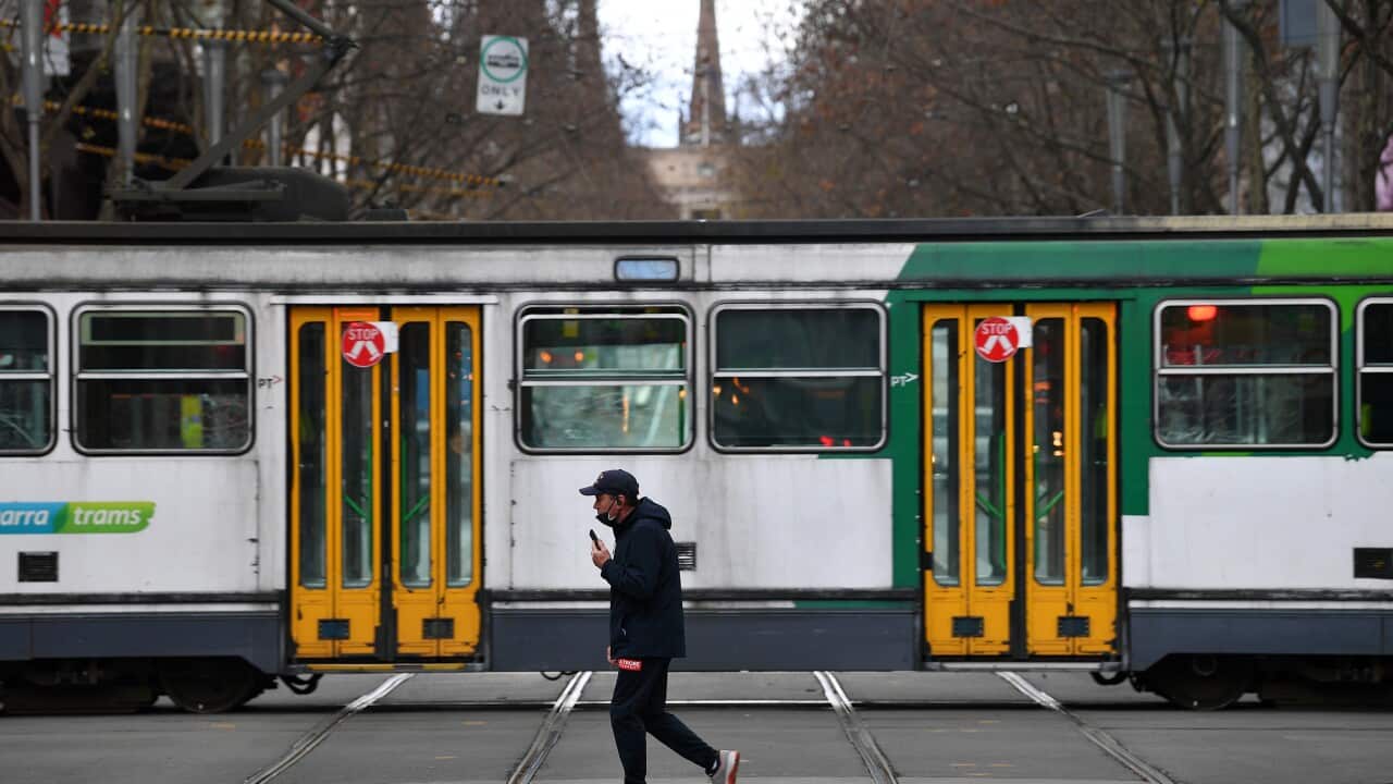 A person wearing a face mask is seen in Melbourne, Friday, 23 July, 2021.