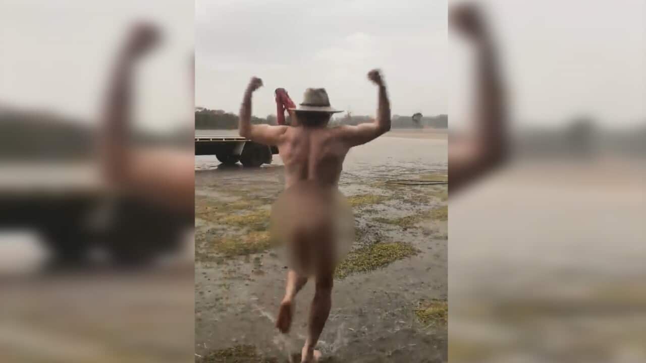 Glen Bloink celebrating the much needed deluge. Image from the footage via Min Coleman.