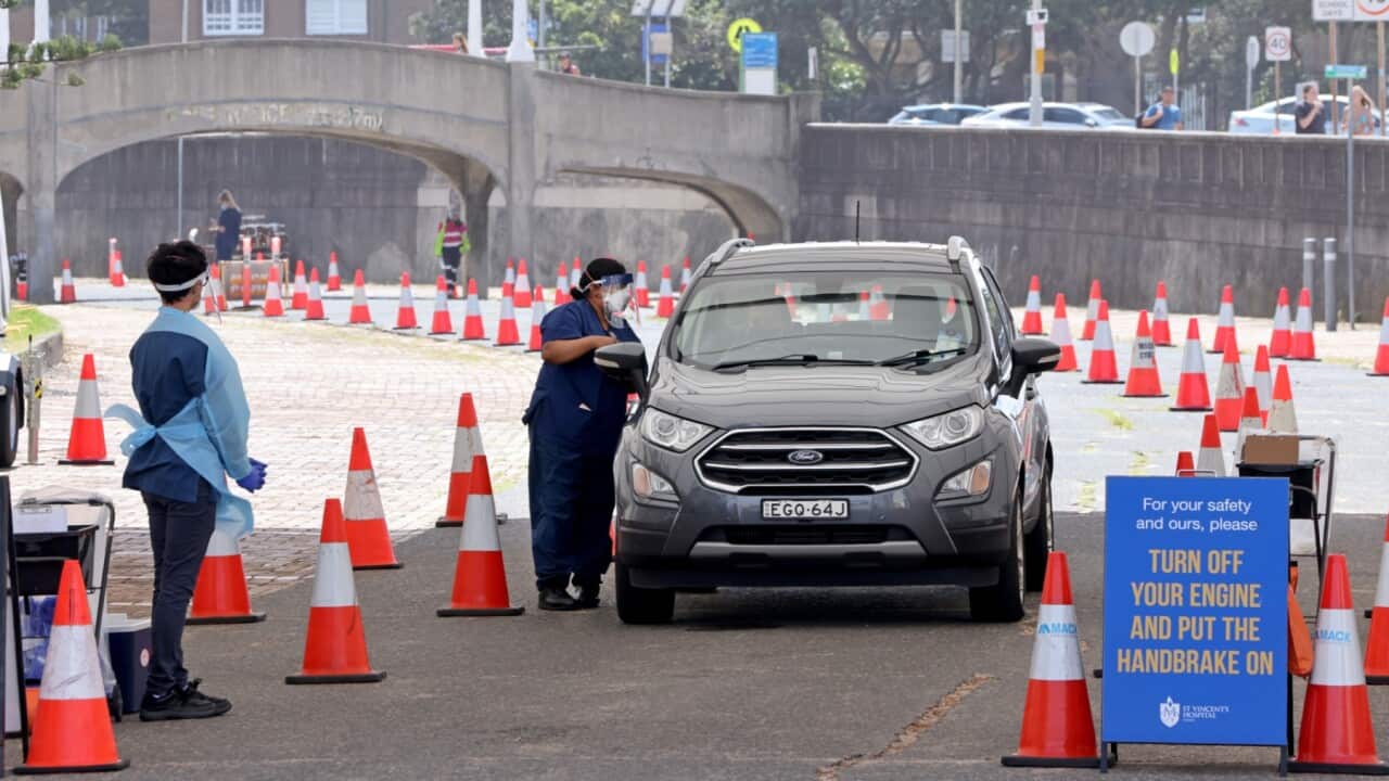 People are tested for COVID-19 at a drive through facility in Sydney, Monday, January 24, 2022.