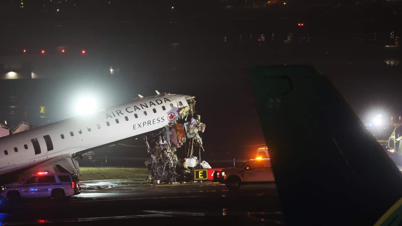 Air Canada Express plane with serious damage to the nose of the plane.