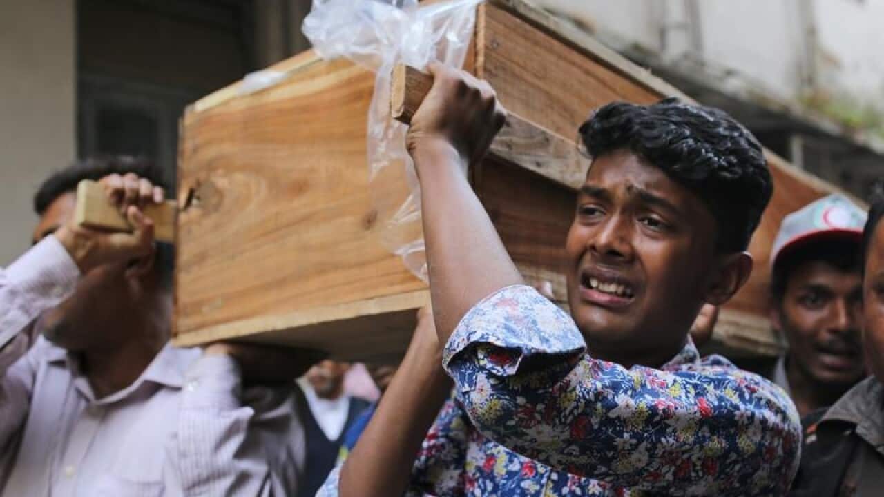 A Bangladeshi boy carries his relative