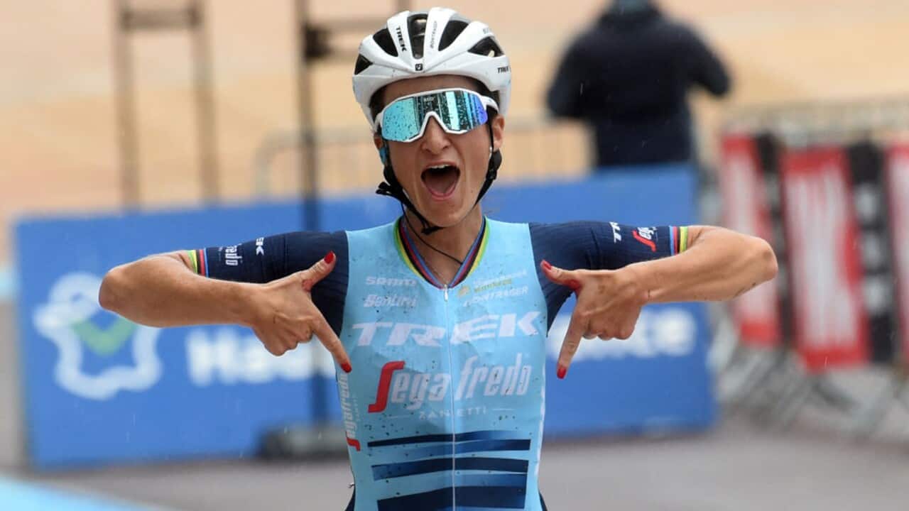 Lizzie Deignan celebrates after winning a race for Trek-Segafredo