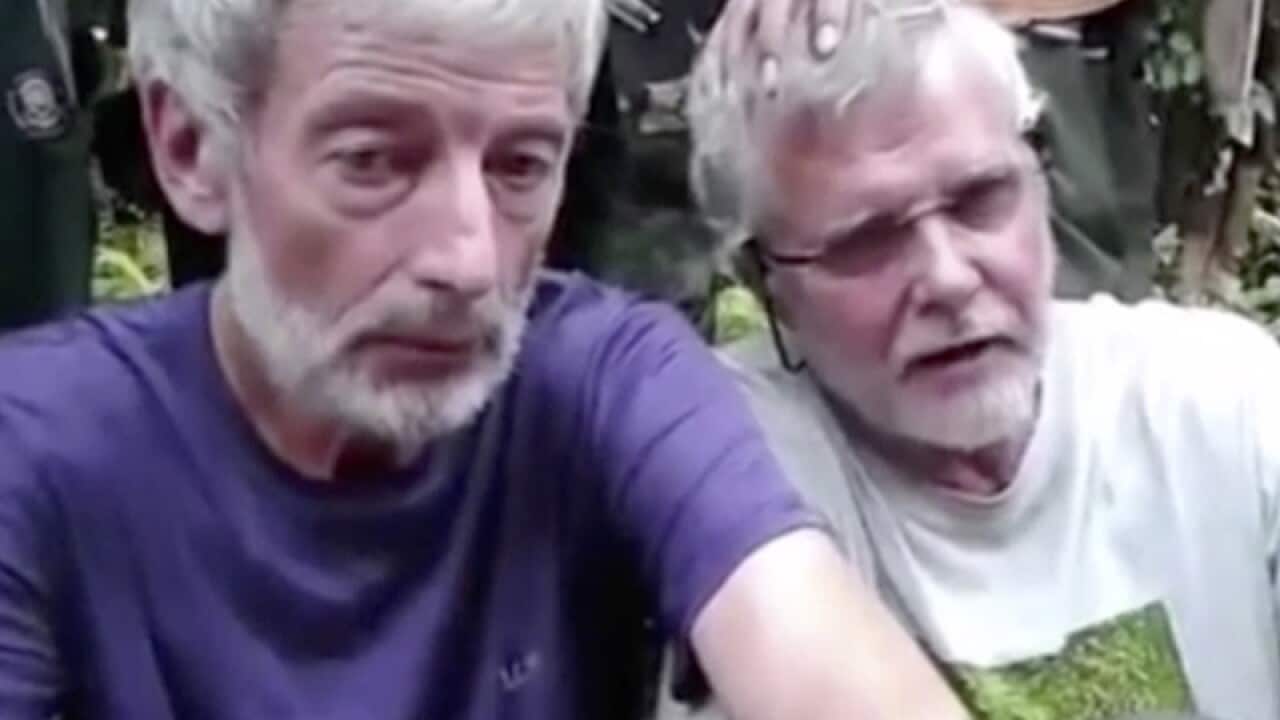 Canadians Robert Hall, left, and John Ridsdel, right