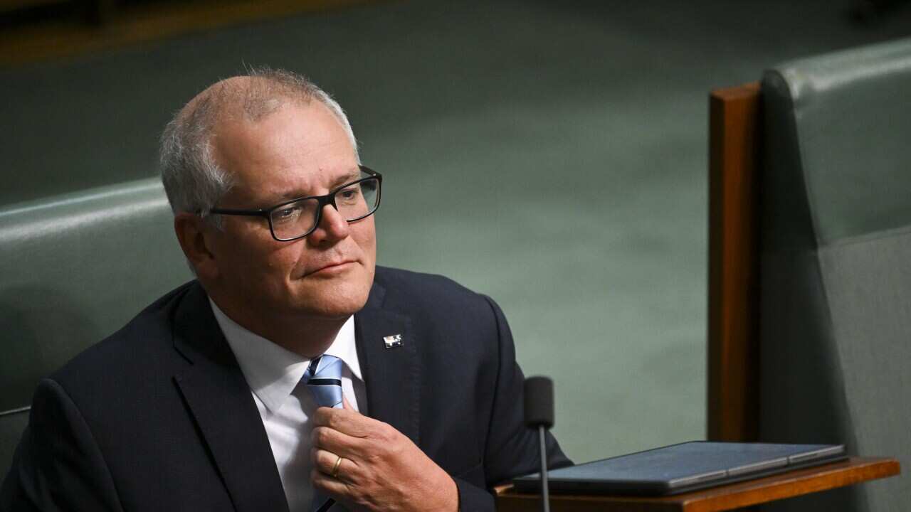 Former Australian Prime Minister Scott Morrison reacts during a censure motion moved against him by the Leader of the House Tony Burke in the House of Representatives at Parliament House in Canberra, Wednesday, November 30, 2022.