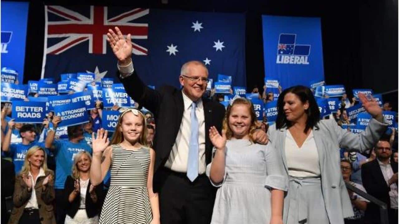Prime Minister Scott Morrison with daughters Abbey, Lily and wife Jenny at Sunday's campaign rally.