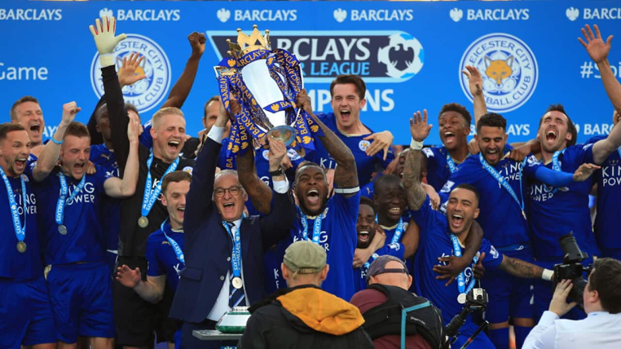 Leicester City captain Wes Morgan and Claudio Ranieri lift the trophy