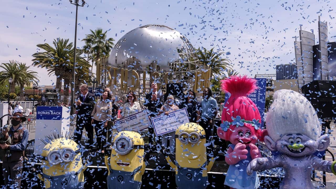 California Governor Gavin Newsom (c) celebrates with other guests at Universal Studios