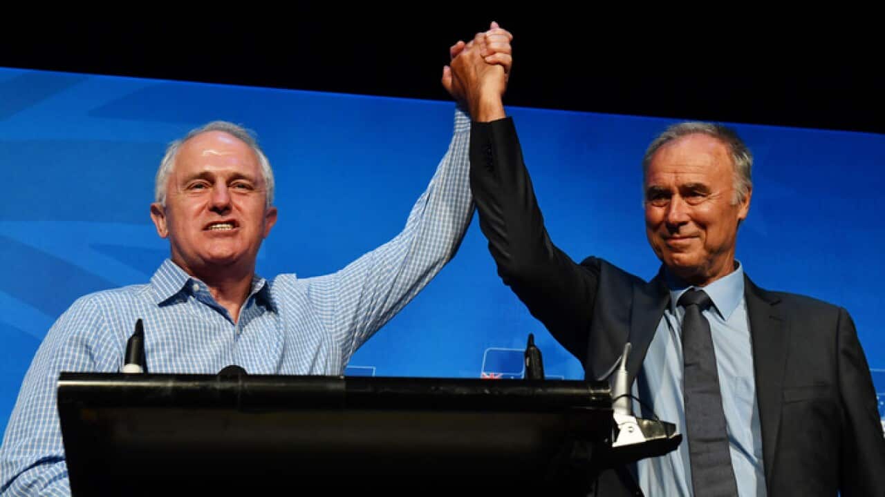Prime Minister Malcolm Turnbull and newly elected Liberal member for Bennelong John Alexander celebrate at the by-election night party at the West Ryde Leagues Club in Sydney, Saturday, December 16, 2017. (AAP Image/Mick Tsikas) NO ARCHIVING