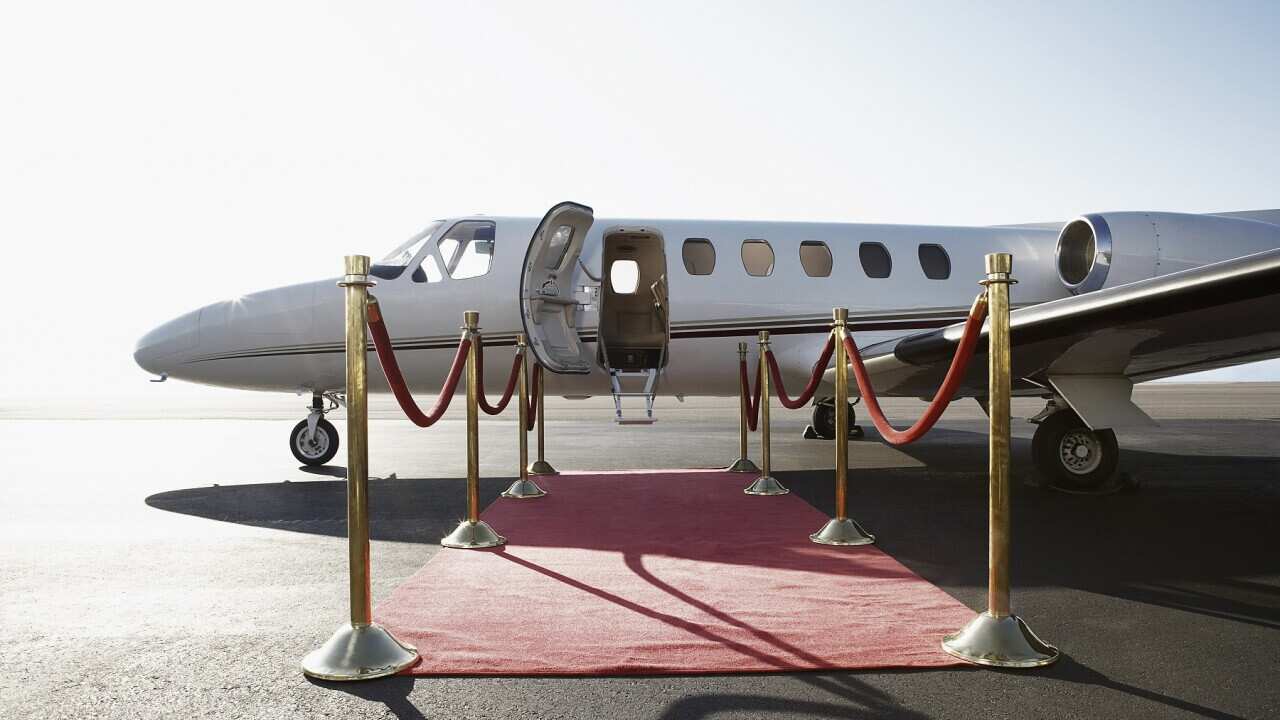 Private airplane with red carpet