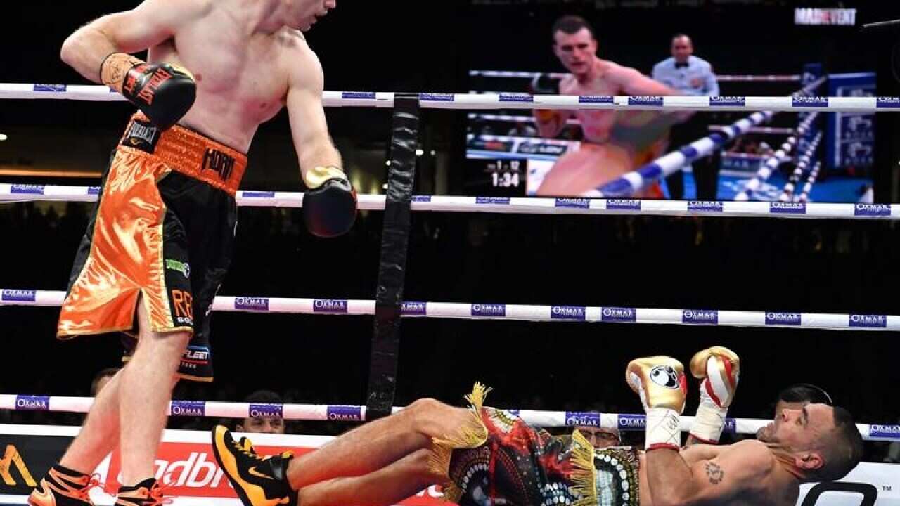 Boxer Jeff Horn (L) knocks out Anthony Mundine