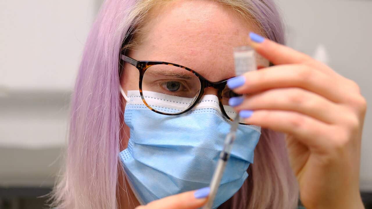 A medical staffer at Midtown Medical Clinic prepares a dose of the Pfizer vaccine on Monday, 5 July, 2021.