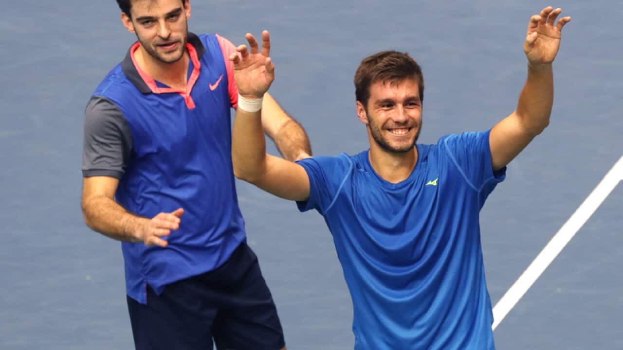 Croatia's Nikola Mektic (R) and Marin Draganja celebrate winning