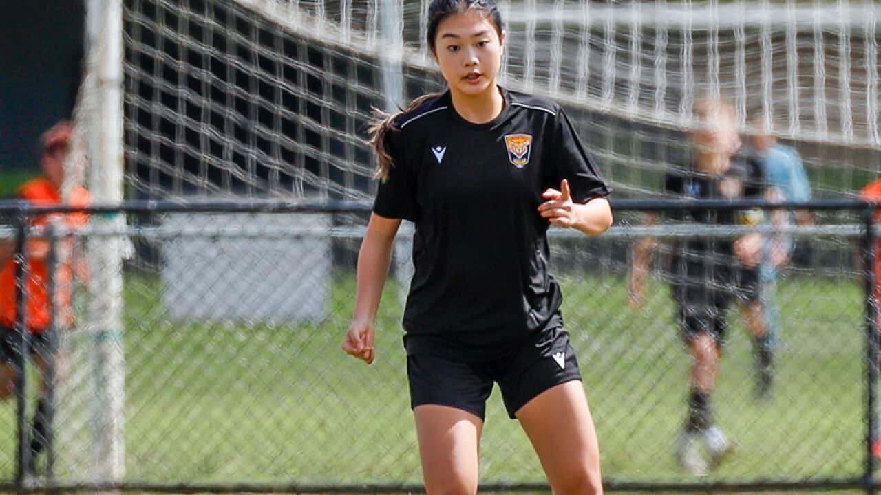 Elika Halim looking composed on the ball.