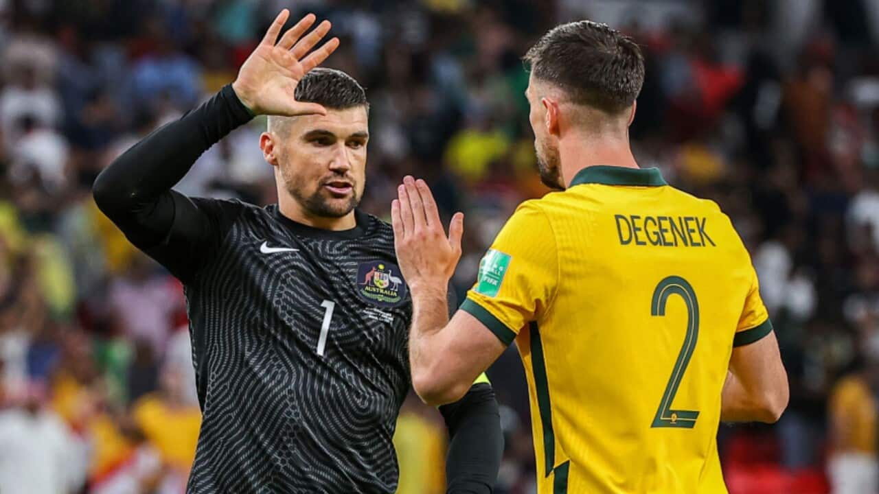 Captain Mat Ryan congratulates Milos Degenek after a Socceroos match
