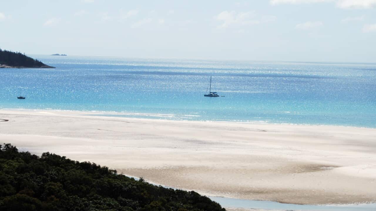A catamaran moored off Whitehaven Beach in the Whitsunday Islands