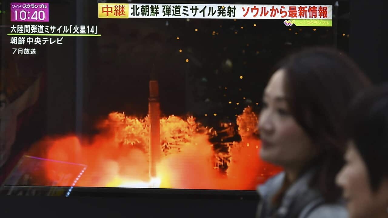 A TV screen on the street broadcasts the news of North Korea's intercontinental ballistic missile (ICBM) in Tokyo on November 29, 2017.