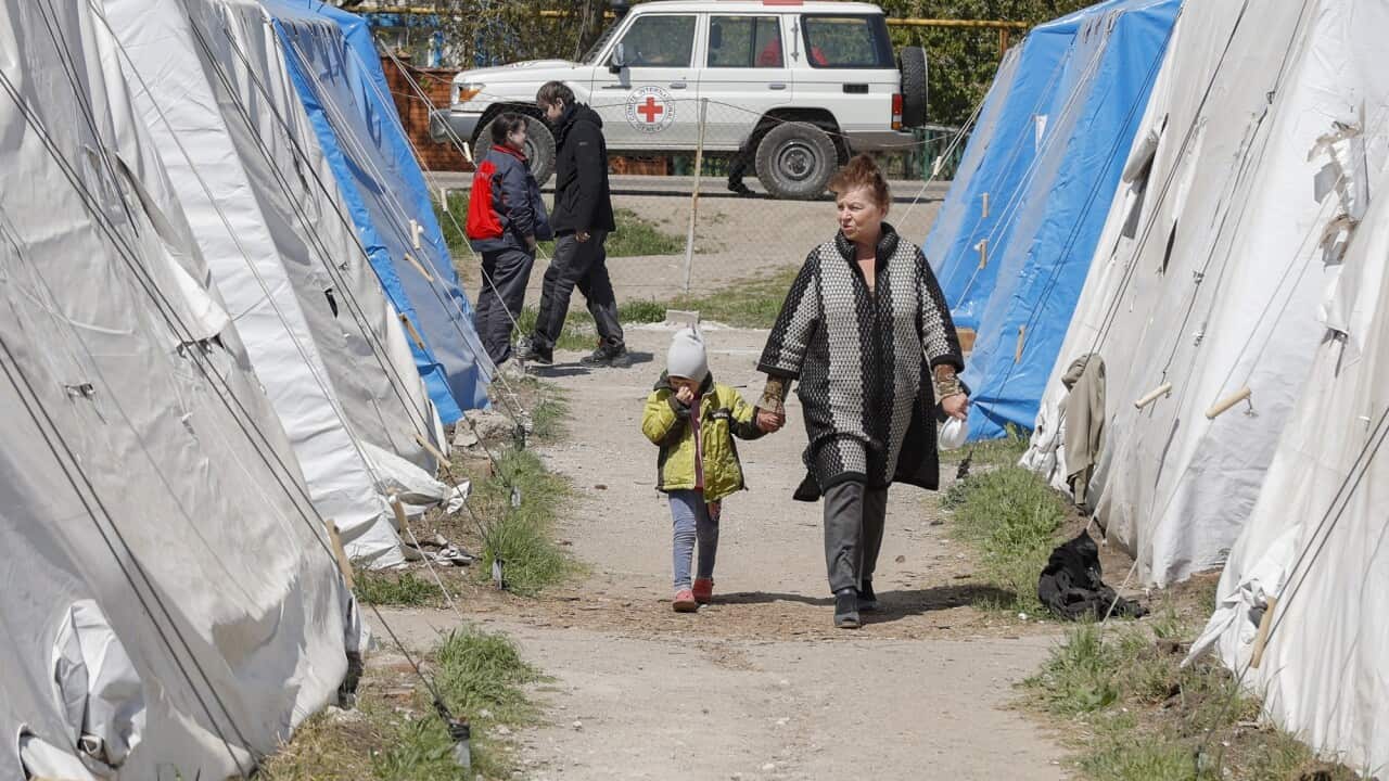 Ukrainian civilians arrive at a temporary camp after being evacuated from the Azovstal steel plant in Mariupol.